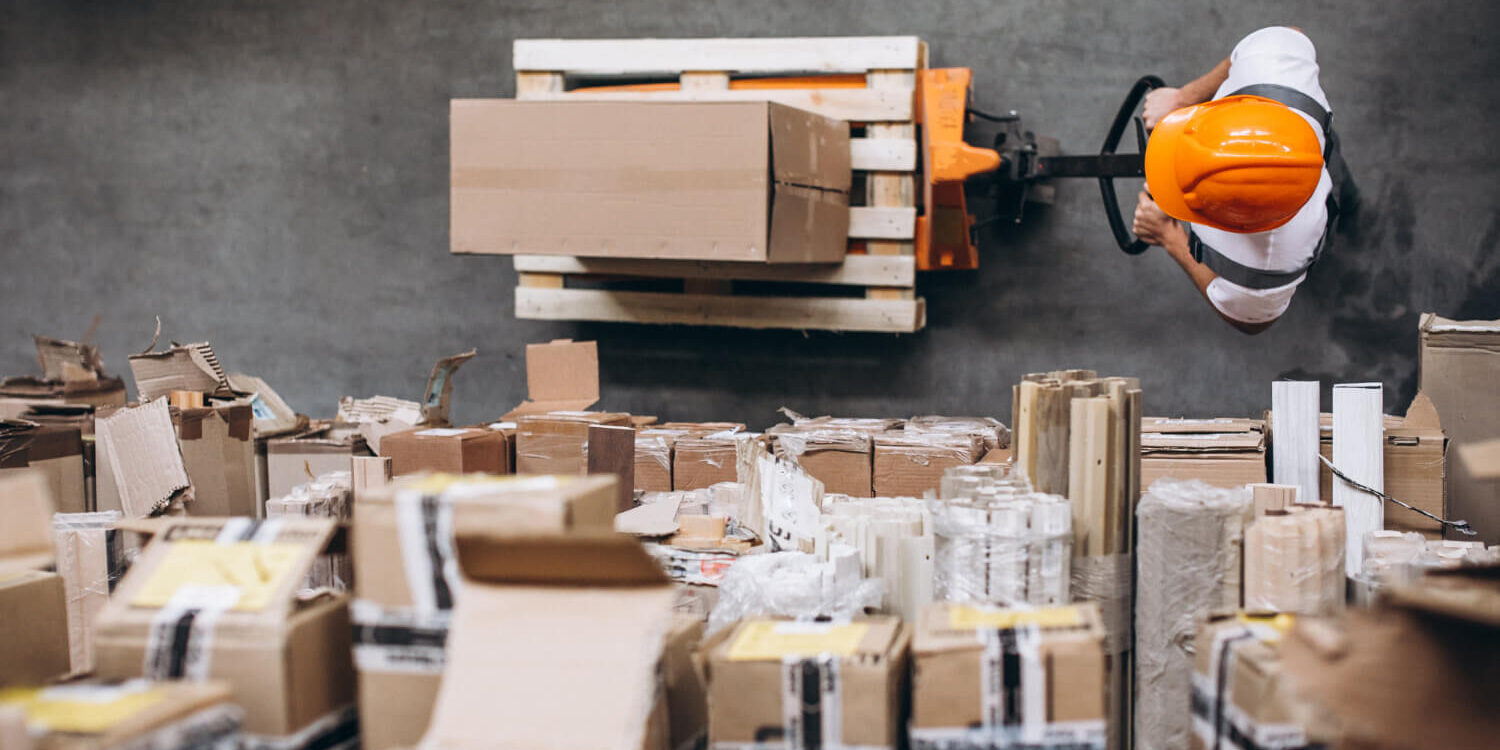 young-man-working-at-a-warehouse-with-boxes